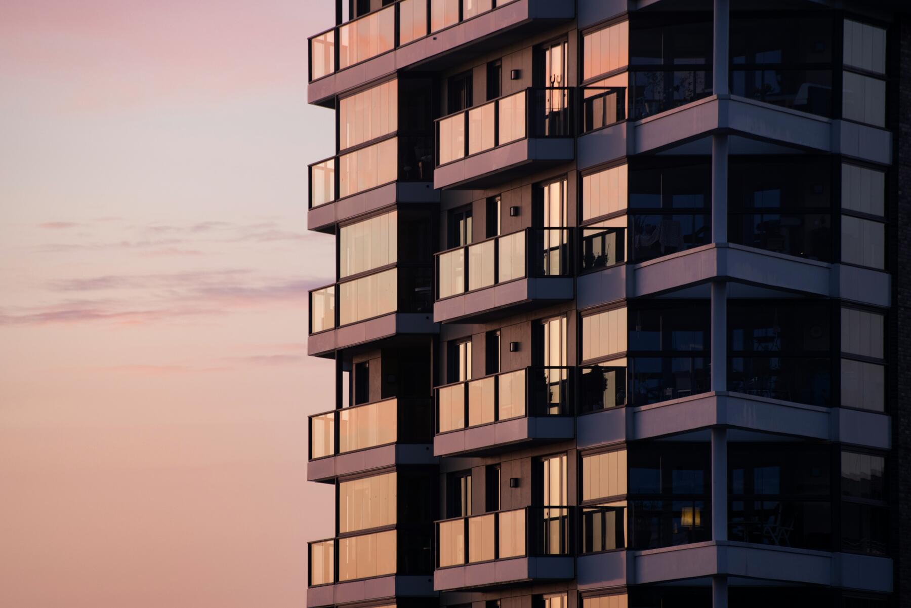 The Vermeil facade at dusk — glass balconies catching the last light over Marylebone